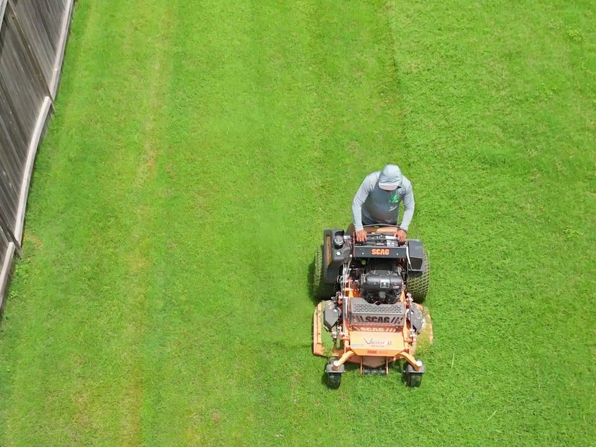 Overhead view of a zero-turn mower striping a lawn